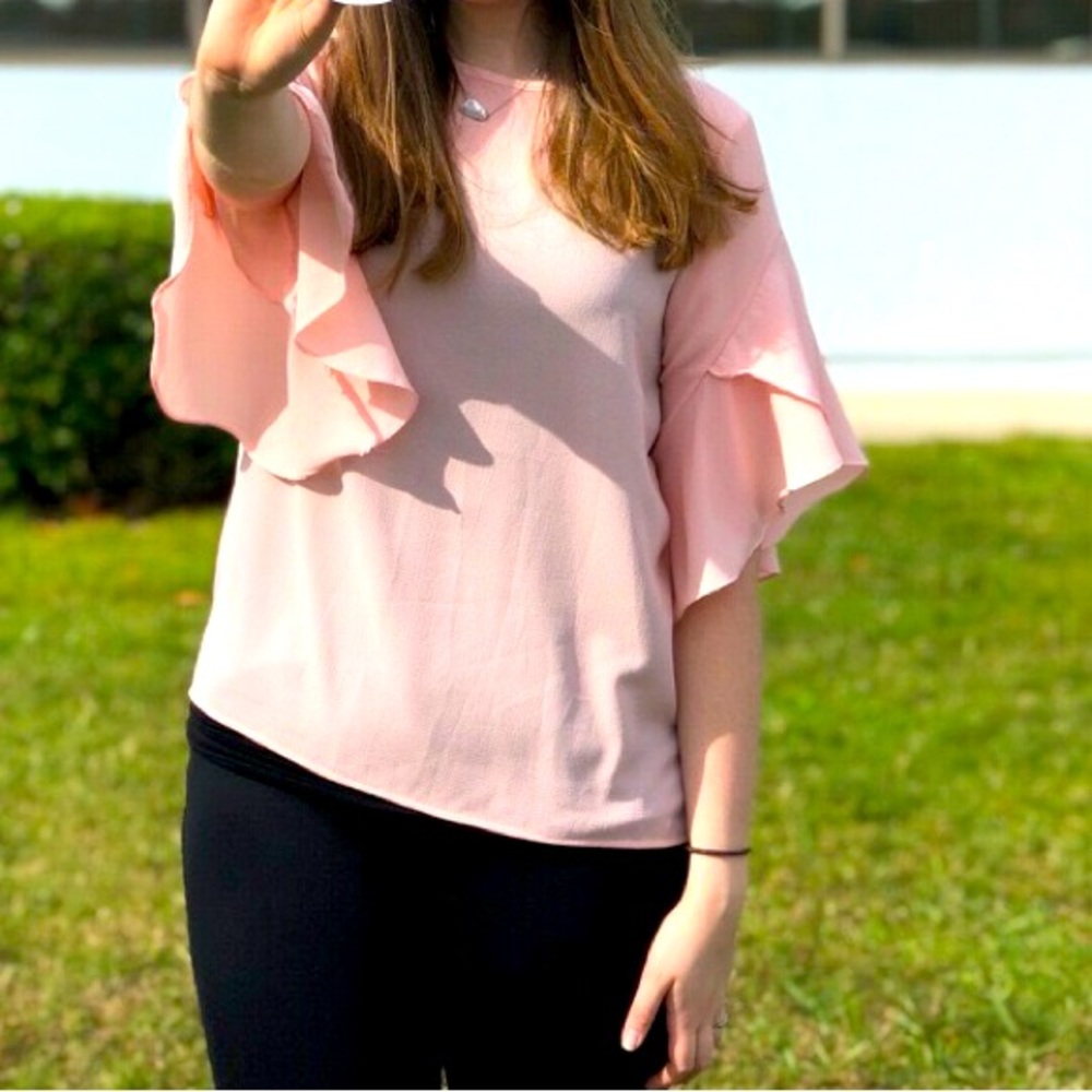 Business casual pink dress top with flow, flutter sleeve. Size medium.